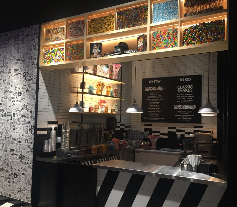 Art-wall track lighting at Black Tap